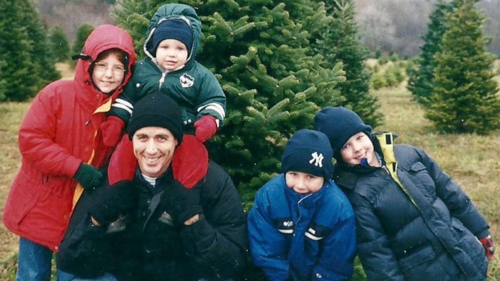 PHOTO: Former Lt. Col. Timothy Brooks poses with his four children before cutting down a Christmas tree at their home in Fort Drum, N.Y., in Nov. 2001.