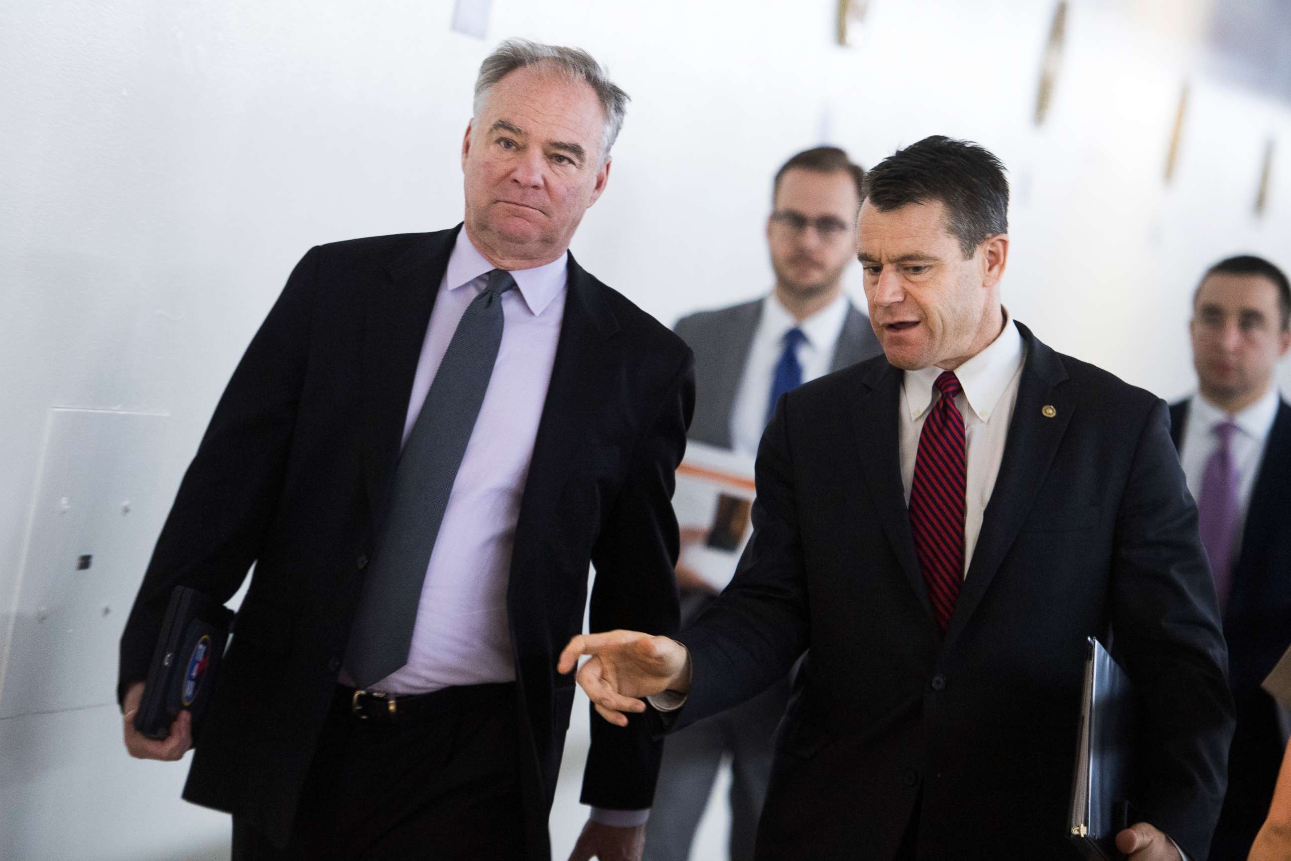 PHOTO: Sens. Tim Kaine and Todd Young walk through the Capitol subway before a  Senate Policy luncheon, in Washington, June 18, 2019.