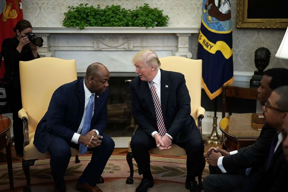 PHOTO: President Donald Trump talks with Sen. Tim Scott during a working session in the Oval Office of the White House, Feb. 14, 2018, in Washington.