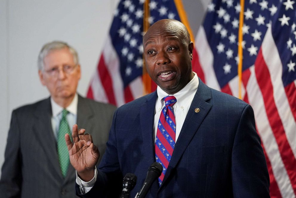 PHOTO: Senate Majority Leader Mitch McConnell listens as Sen. Tim Scott speaks to reporters after the Senate Republicans weekly policy lunch on Capitol Hill in Washington, D.C., June 23, 2020.
