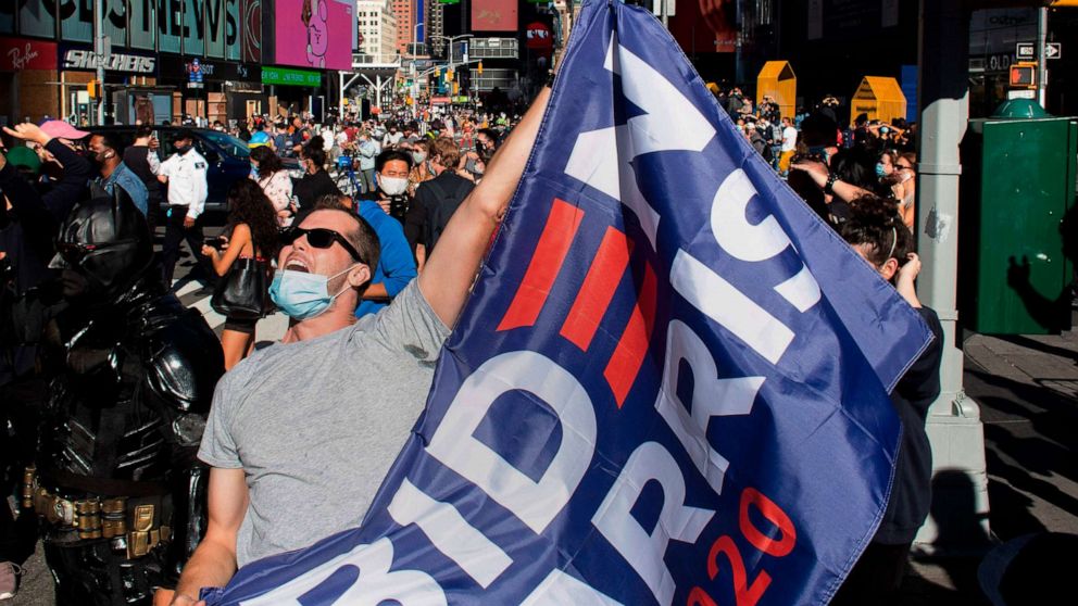 PHOTO: People celebrate in Times Square after Joe Biden became the apparent winner of the 2020 presidential election, Nov. 7, 2020, in New York.