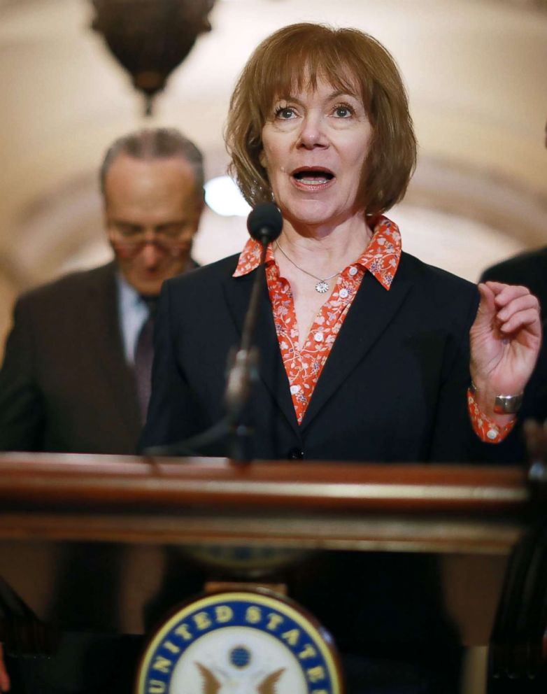PHOTO: Sen. Tina Smith, center, talks with reporters, April 17, 2018, in Washington, D.C.