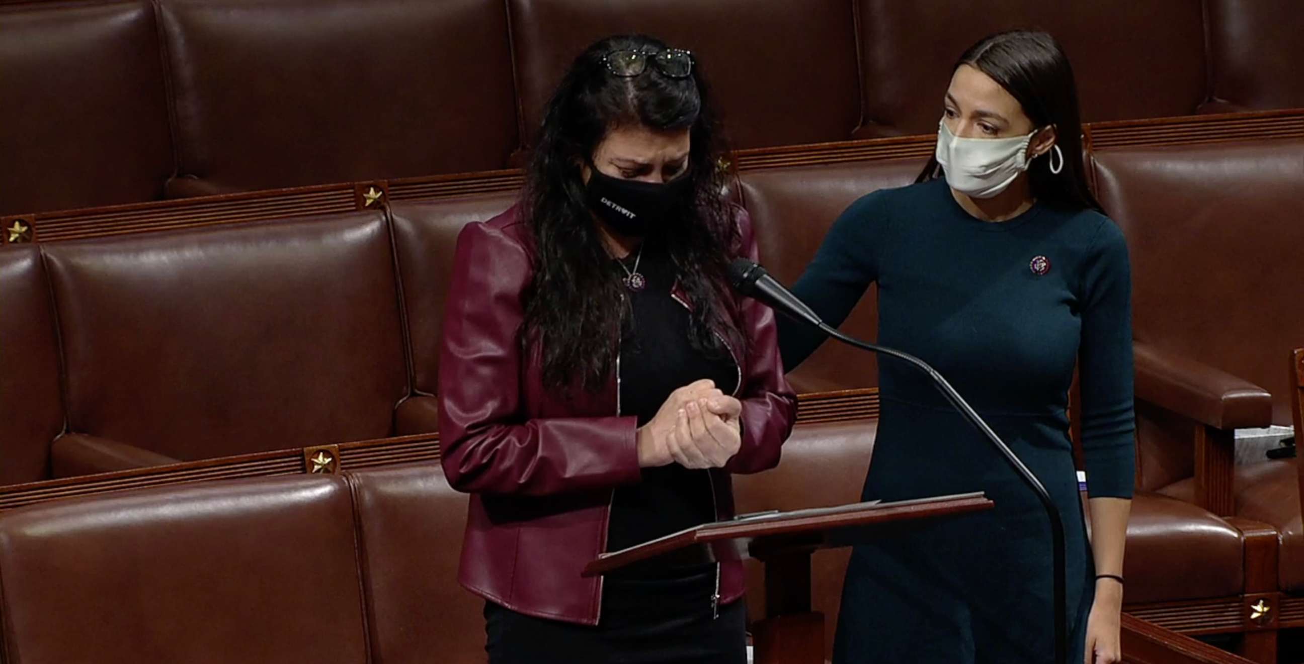 PHOTO: Rep. Rashida Tlaib is comforted by Rep. Alexandria Ocasio-Cortez while speaking on the house floor at the Capitol, Feb. 4, 2021.