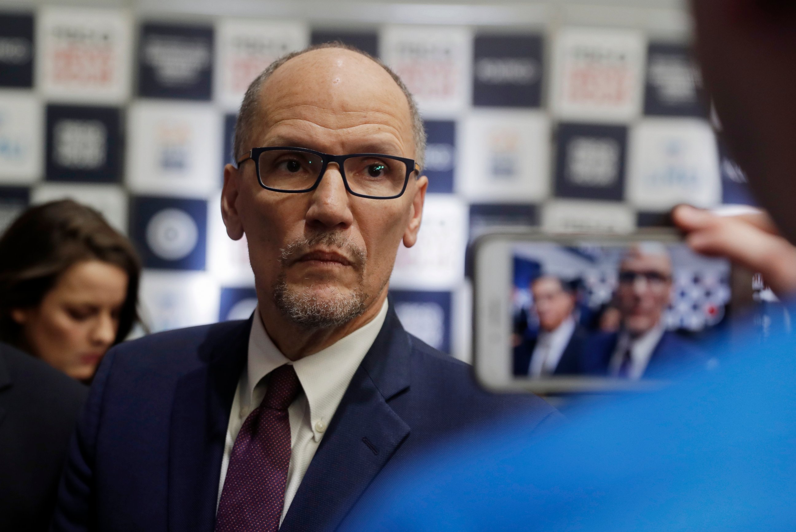 PHOTO: In this Dec. 19, 2019, file photo Democratic National Committee chairman Tom Perez is recorded on a phone before a Democratic presidential primary debate in Los Angeles.