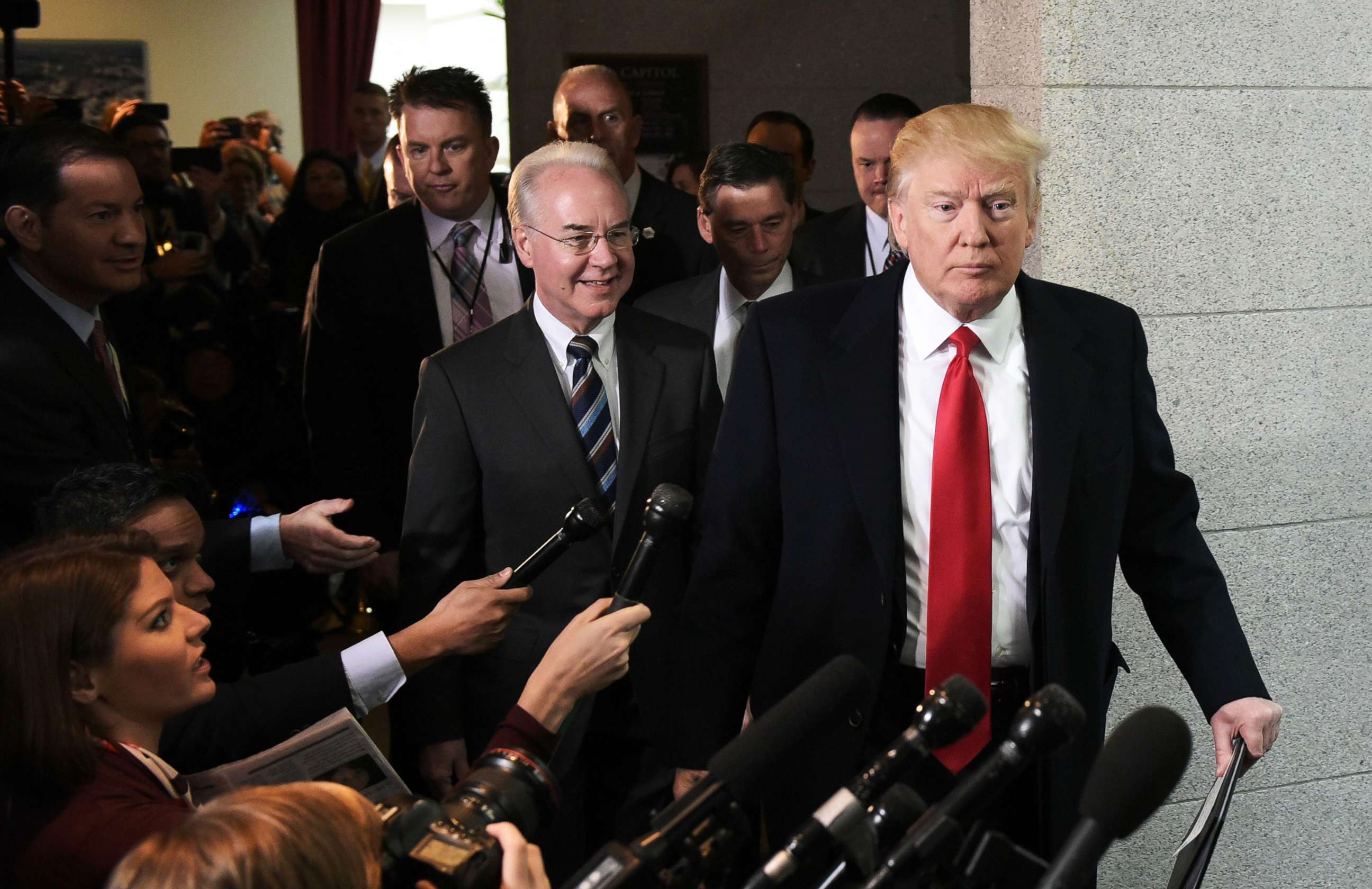 PHOTO: Health and Human Services Secretary Tom Price and President Donald Trump arrive at the US Capitol to meet with the Republican House Conference, March 12, 2017. 
