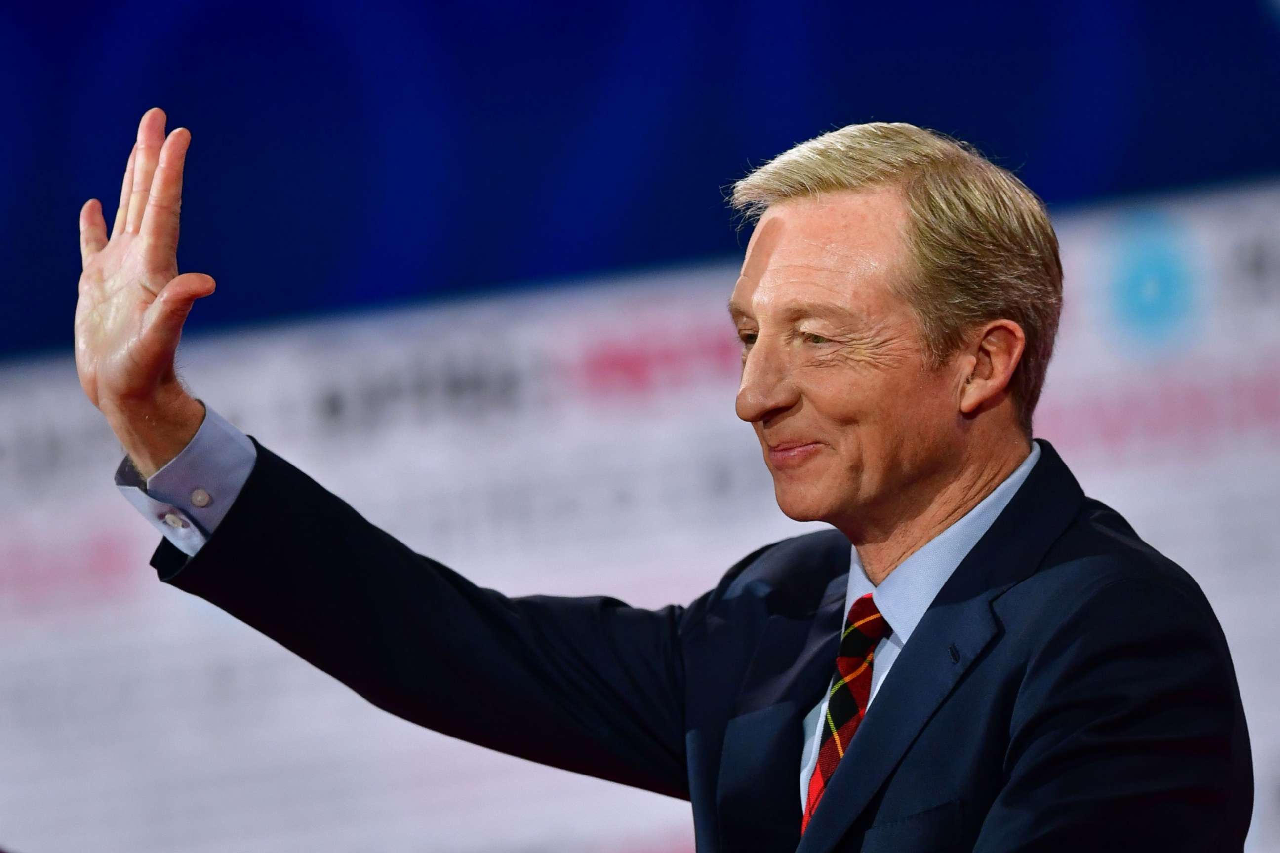 PHOTO: Democratic presidential hopeful businessman Tom Steyer waves ahead of the sixth Democratic primary debate of the 2020 presidential campaign season co-hosted by PBS NewsHour & Politico at Loyola Marymount University in Los Angeles, Dec. 19, 2019.