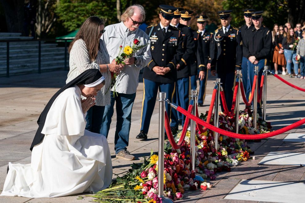 PHOTO: A nun prays after placing flowers during a centennial commemoration event at the Tomb of the Unknown Soldier in Arlington National Cemetery, November 9, 2021, in Arlington, Va.
