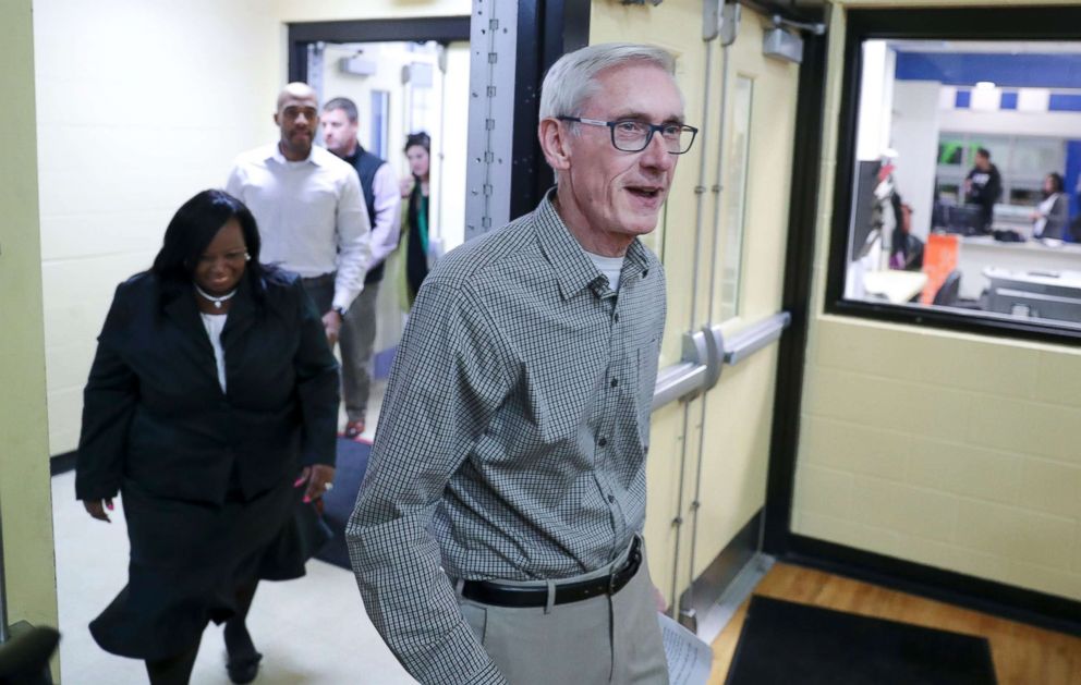 PHOTO: Governor-elect Tony Evers walks into a room filled with press before making a statement, and answering questions on Wednesday Nov. 7, 2018.