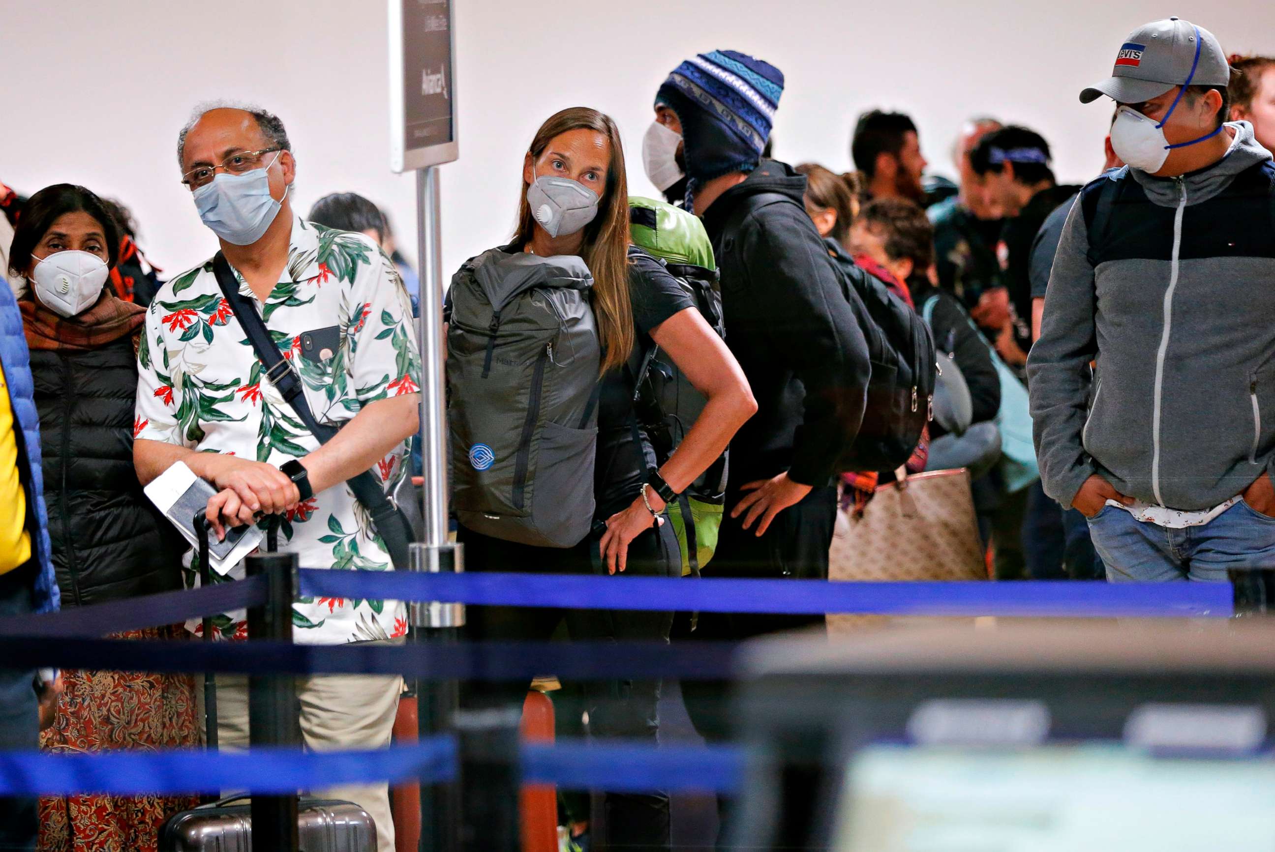 PHOTO: Travelers wait for their flights out of Peru, on March 16, 2020, at the Jorge Chavez international airport in Callao, Lima, minutes before borders are closed.