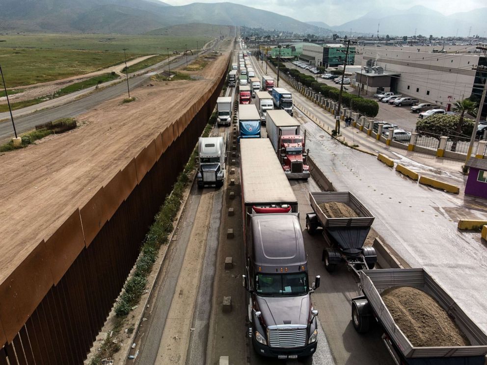 PHOTO: Aerial view of cargo trucks lining up to cross to the United States near the US-Mexico border at Otay Mesa crossing port in Tijuana, Baja California state, Mexico, on April 4, 2019.