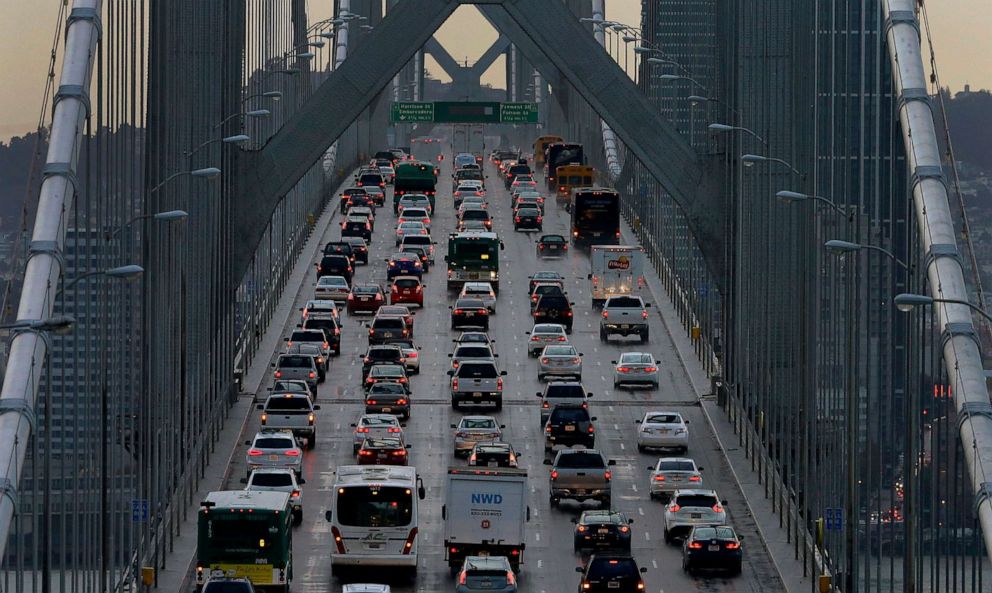 PHOTO: Vehicles make their way westbound on Interstate 80 across the San Francisco-Oakland Bay Bridge as seen from Treasure Island in San Francisco, Dec. 10, 2015.