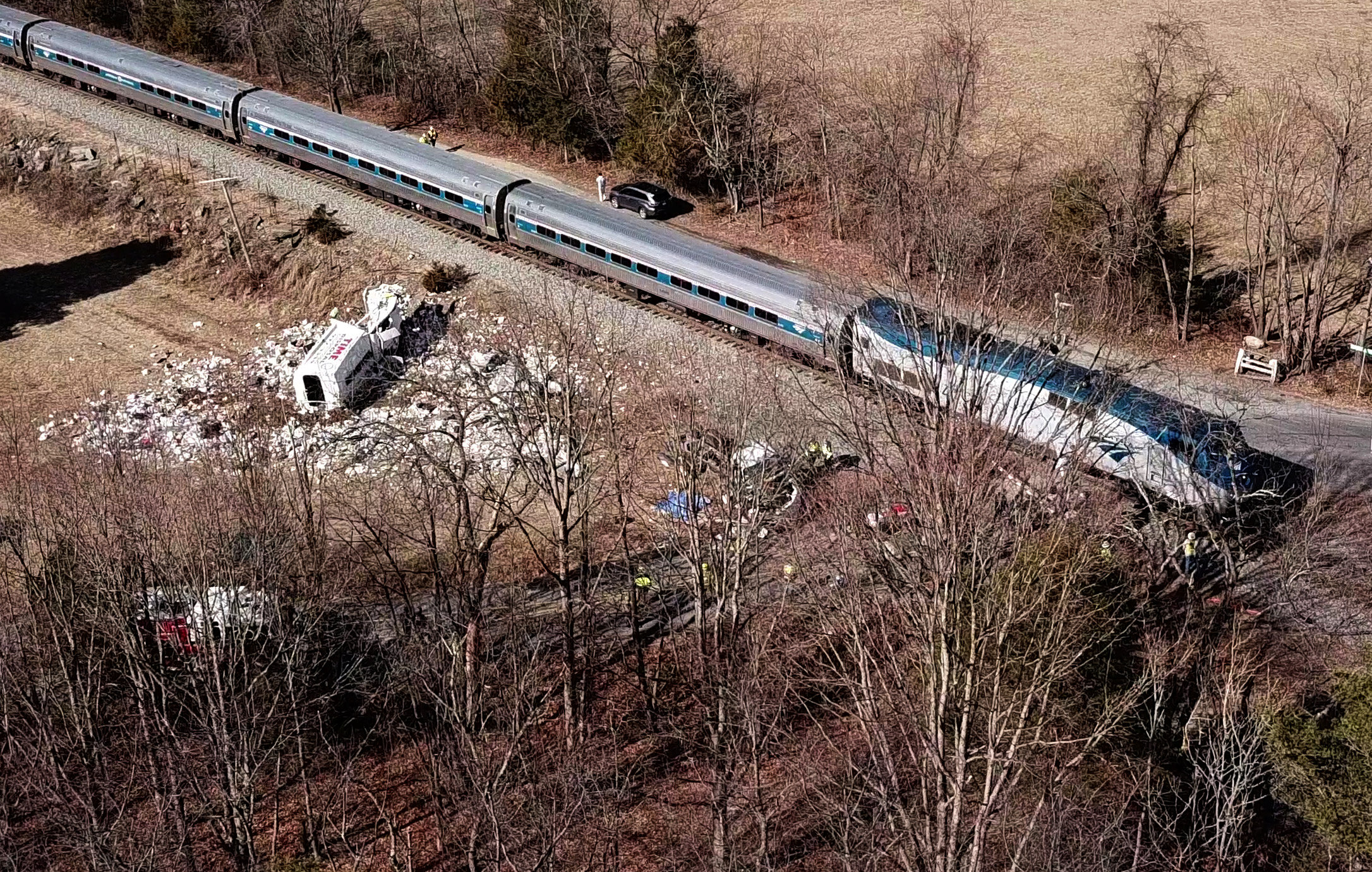 PHOTO: The wreckage of a garbage truck lies beside an Amtrak passenger train after a collision in Crozet, Va., Jan. 31, 2018.