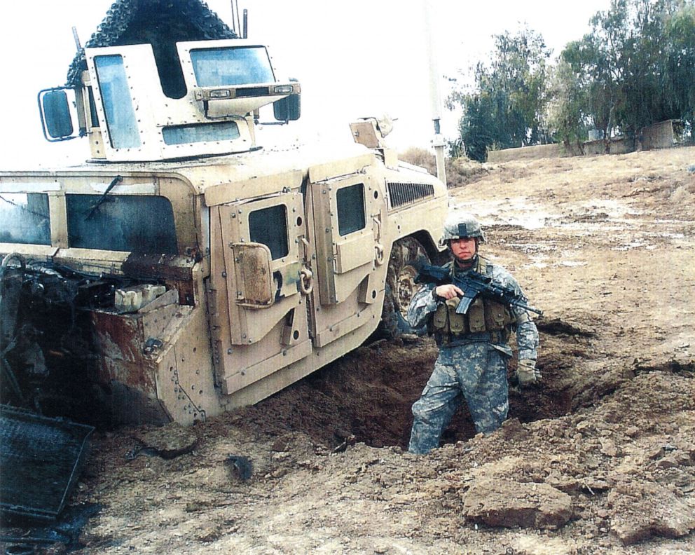 PHOTO: Sgt. Travis Atkins stands next to his vehicle after it was damaged by an improvised explosive devise in Iraq during 2007.