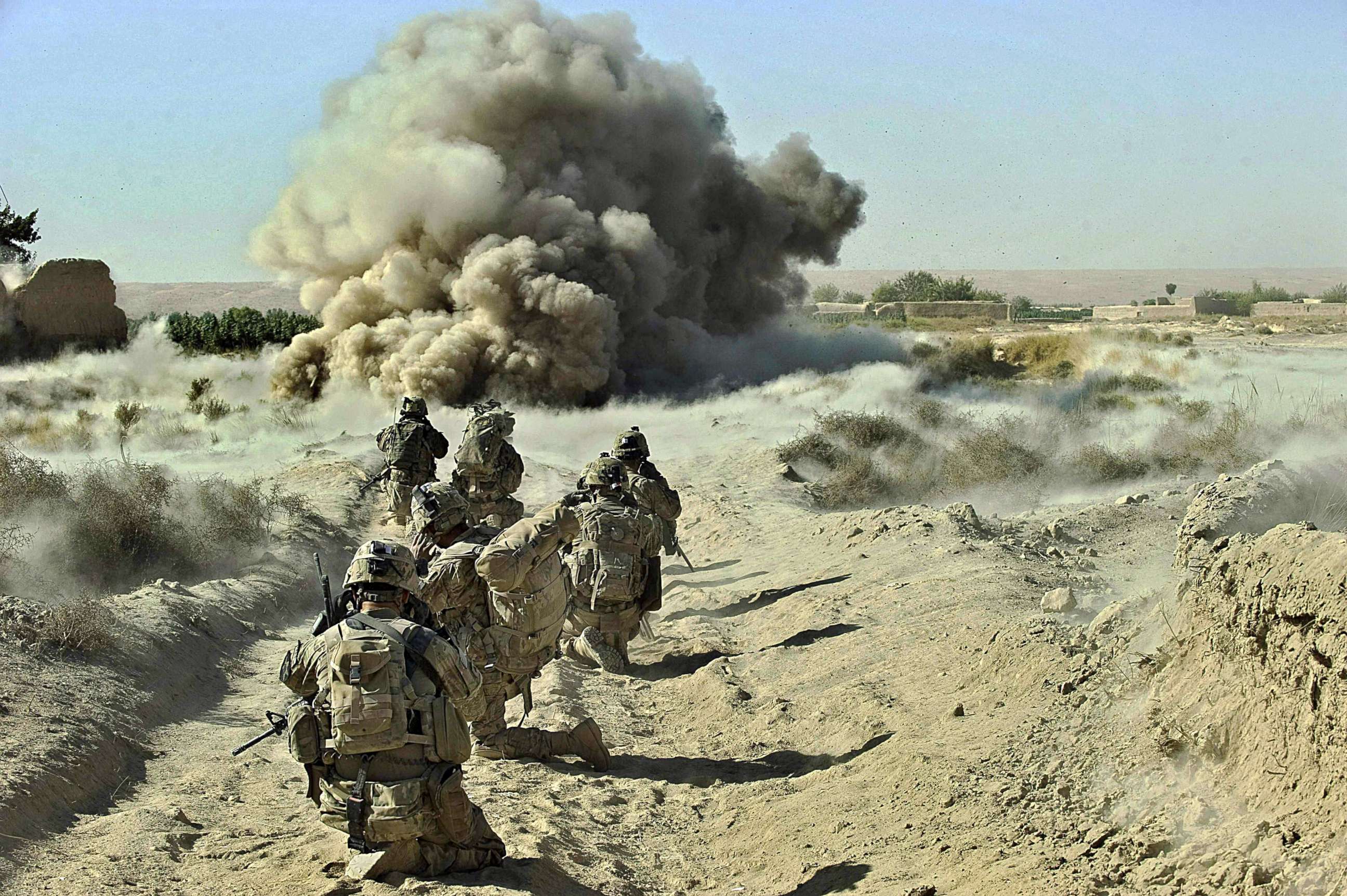 PHOTO: Dust kicks off the ground during an operation by US Army soldiers attached to the 2nd platoon, C-Coy. 1-23 Infantry based at Zangabad foward operating base in Panjwai ditrict, Afghanistan, Sept. 23, 2012.