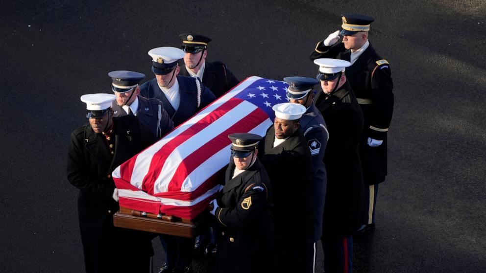 PHOTO: The flag-draped casket of former President Jimmy Carter is transferred to a horse-drawn caisson at the U.S. Navy Memorial before traveling on to the Capitol on Jan. 7, 2025, in Washington, DC.