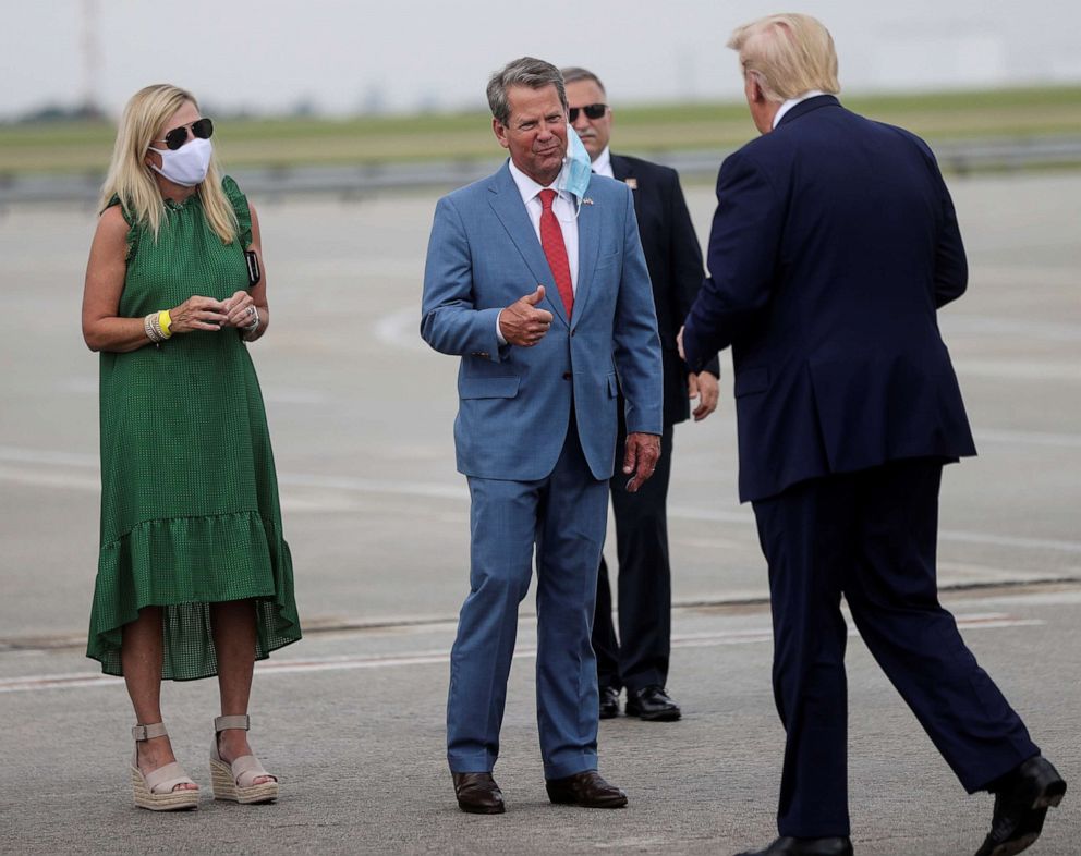 PHOTO: U.S. President Donald Trump is greeted by Georgia Governor Brian Kemp and Marty Kemp as he arrives at Hartsfield-Jackson Atlanta International Airport in Atlanta, Georgia, July 15, 2020.
