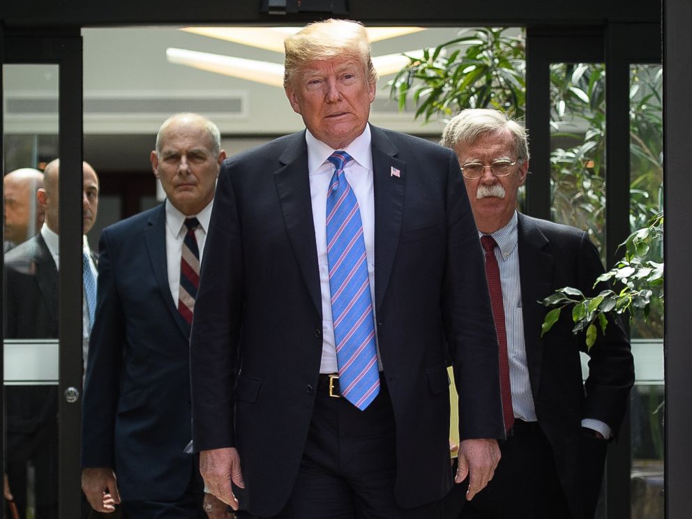 PHOTO: Donald Trump leaves with Chief of Staff John Kelly and National Security Advisor John Bolton after holding a press conference, June 9, 2018 ,in La Malbaie, Canada.