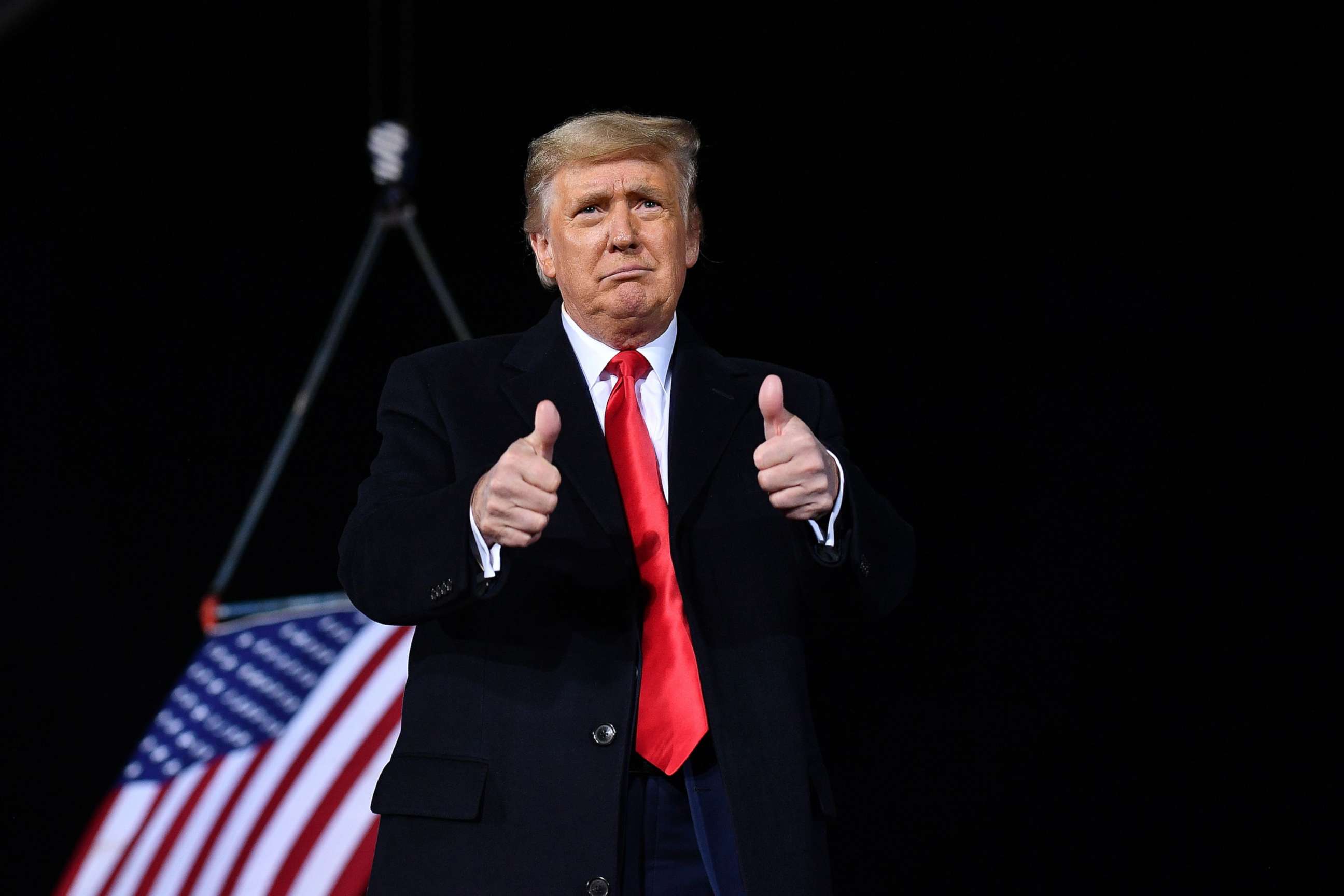 PHOTO: In this Jan. 4, 2021, file photo, President Donald Trump gives two thumbs up during a rally in support of Republican incumbent senators Kelly Loeffler and David Perdue ahead of Senate runoff in Dalton, Ga.