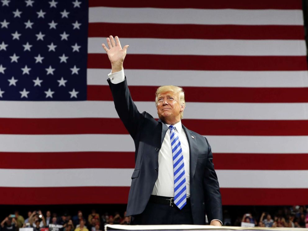 PHOTO: Donald Trump waves as he arrives to speak during a rally, Aug. 21, 2018, in Charleston, W.Va.