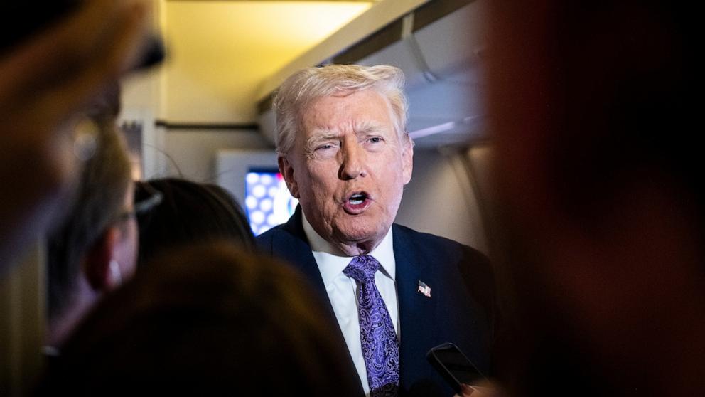 PHOTO: Donald Trump speaks to the press aboard Air Force One en-route to Washington, DC on November 30, 2025.