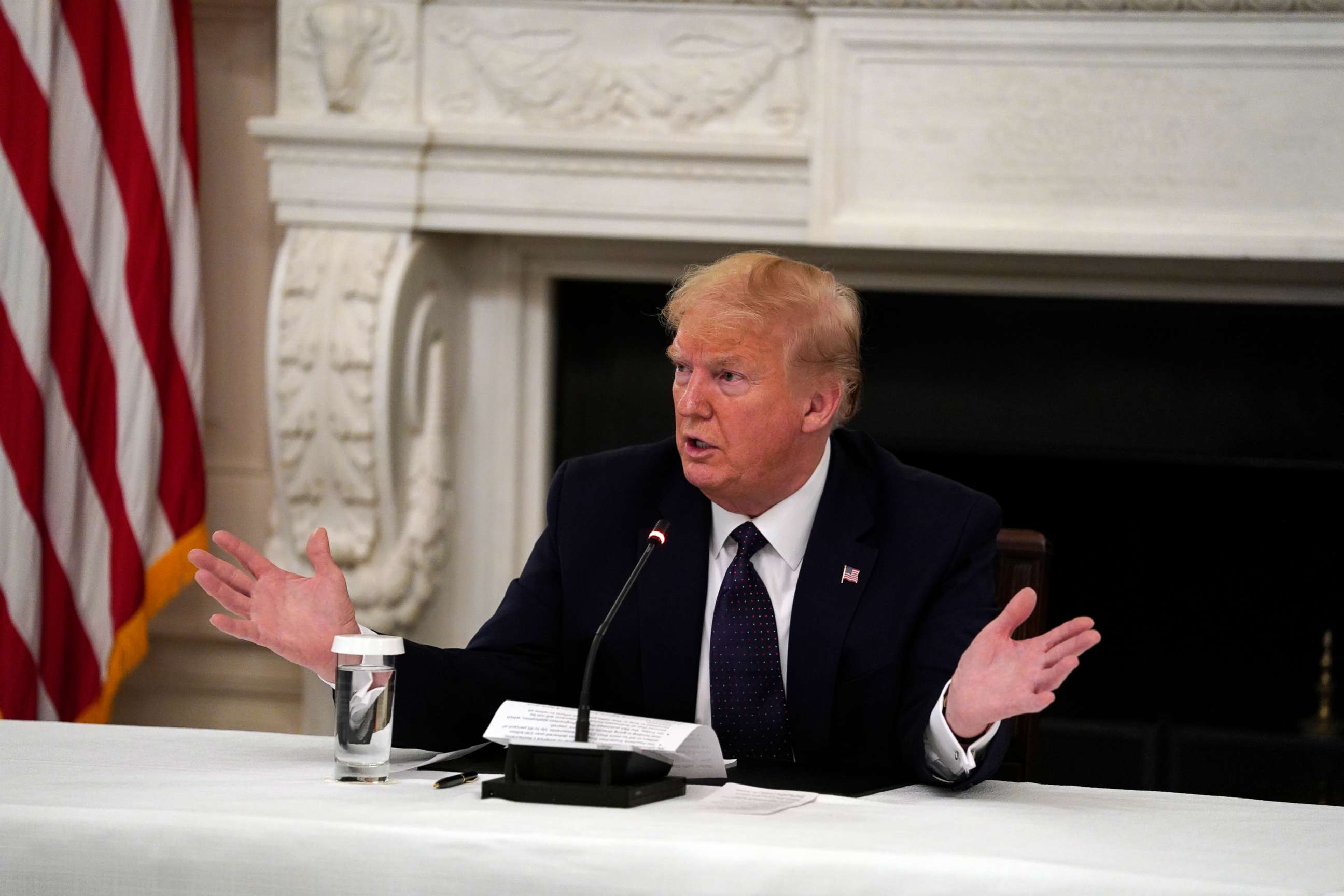 PHOTO: President Donald Trump tells reporters that he is taking zinc and hydroxychloroquine during a meeting with restaurant industry executives about the coronavirus response, in the State Dining Room of the White House, May 18, 2020, in Washington. 