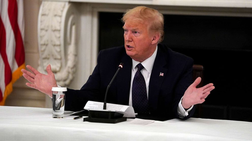 PHOTO: President Donald Trump tells reporters that he is taking zinc and hydroxychloroquine during a meeting with restaurant industry executives about the coronavirus response, in the State Dining Room of the White House, May 18, 2020, in Washington. 