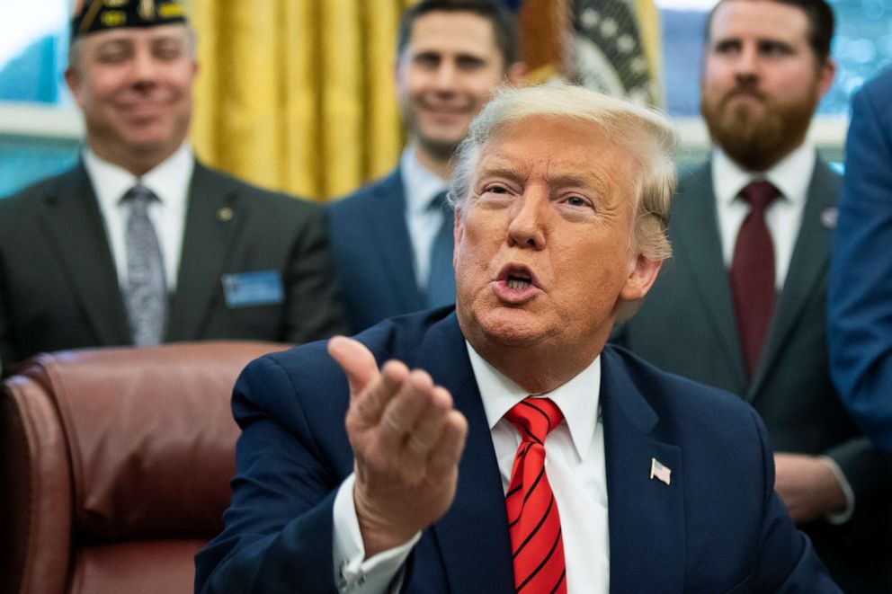 PHOTO: President Donald Trump speaks to reporters during the Supporting Veterans in STEM Careers Act signing ceremony in the Oval Office, Feb. 11, 2020.