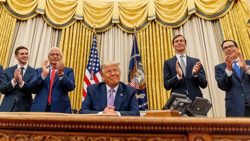 PHOTO: President Donald Trump smiles in the Oval Office at the White House, Aug. 13, 2020.