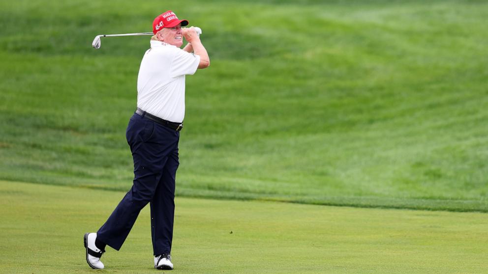 PHOTO: In an Aug. 10, 2023 file photo, President Donald Trump hits his shot from the first fairway prior to the LIV Golf Invitational - Bedminster at Trump National Golf Club, Bedminster, N.J.