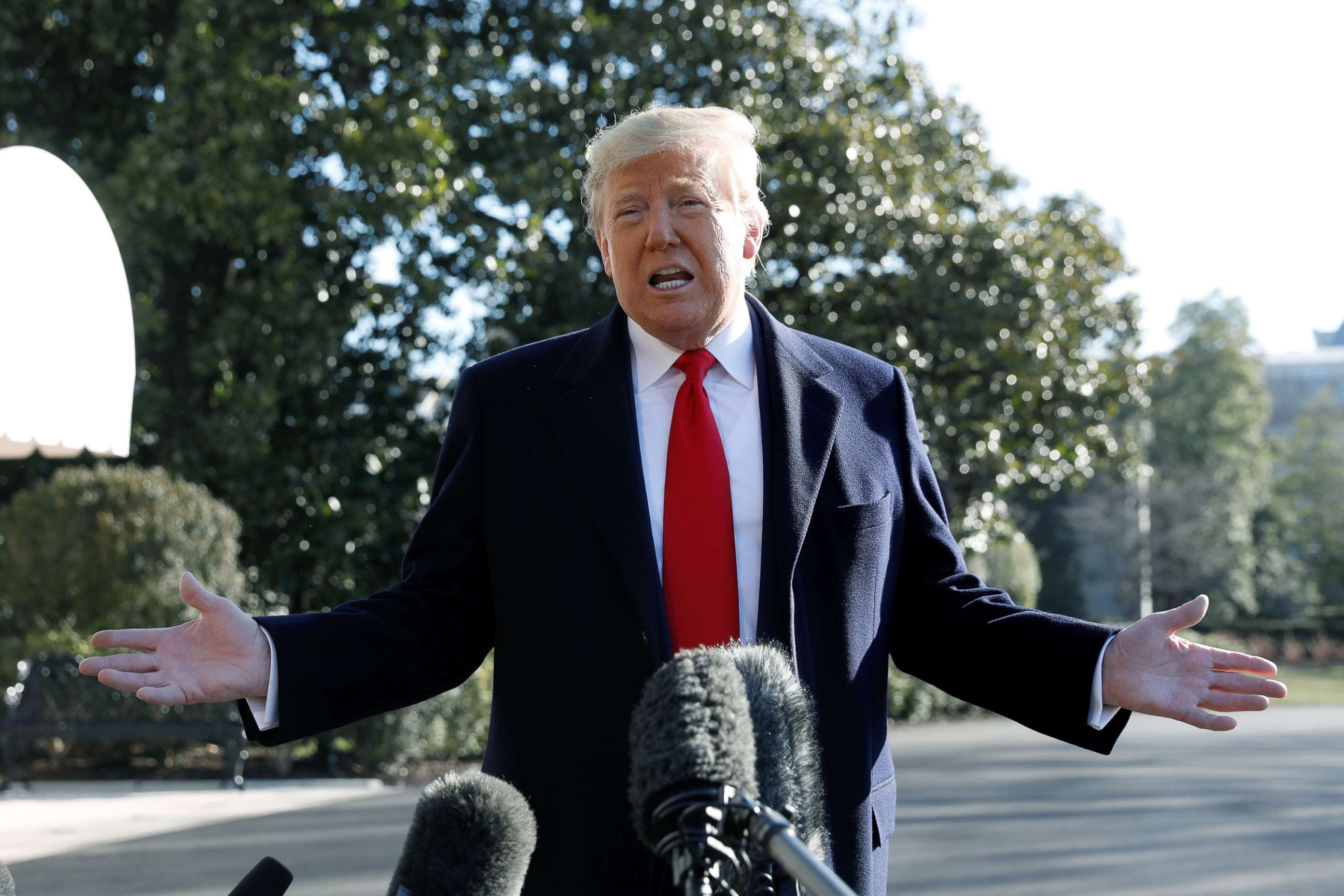 PHOTO: President Donald Trump speaks to the media on the South Lawn of the White House before his departure to India, Feb. 23, 2020. 