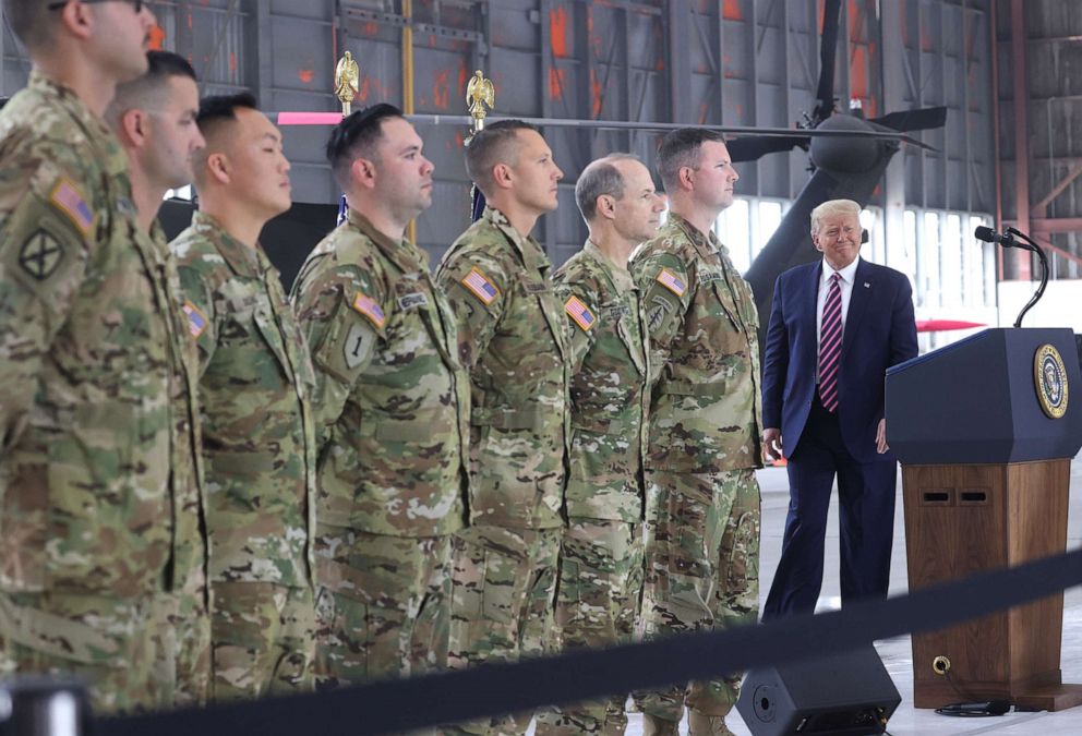 PHOTO: President Donald Trump takes to the podium during a ceremony to present the Distinguished Flying Cross to seven California National Guard helicopter crew members at McClellan Park, Calif., Sept. 14, 2020.