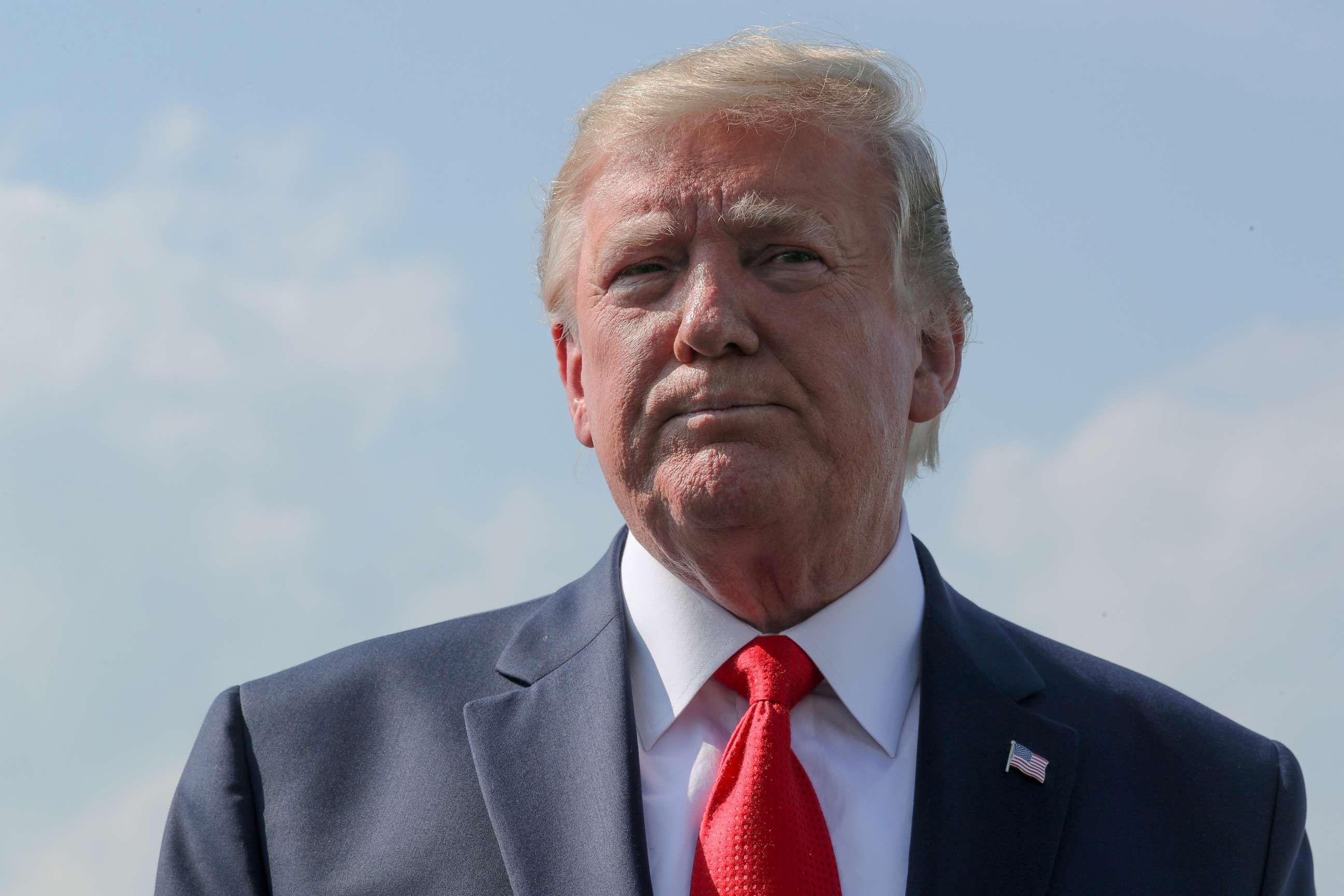 PHOTO: President Donald Trump talks to reporters before boarding Air Force One in Morristown, N.J., July 7, 2019. 