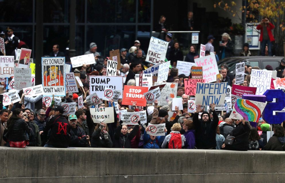 PHOTO: Demonstrators stage a protest across the river from Trump International Hotel and Tower while President Donald Trump visits in Chicago, Oct. 28, 2019. 