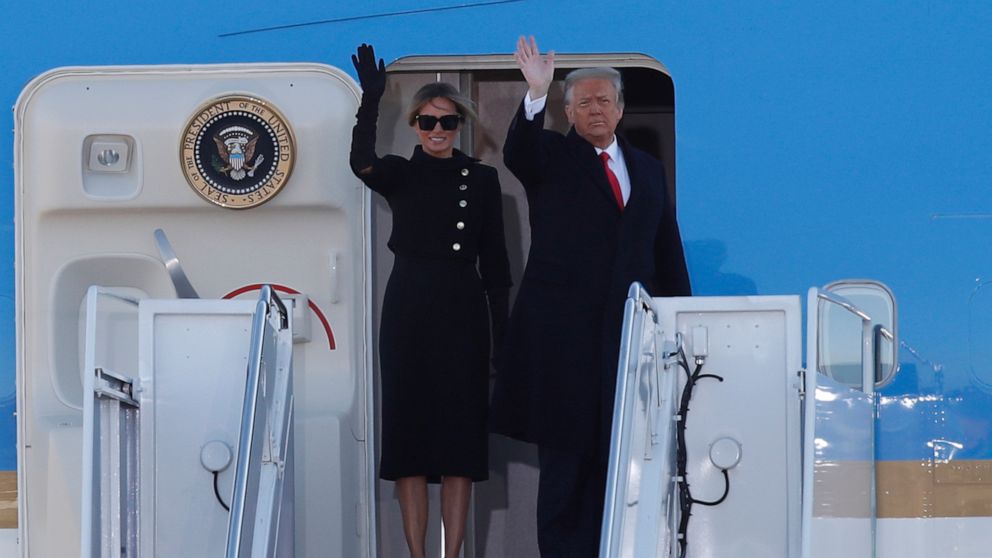 PHOTO: President Donald Trump and first lady Melania Trump wave to a crowd as they board Air Force One at Andrews Air Force Base, Md., Jan. 20, 2021.