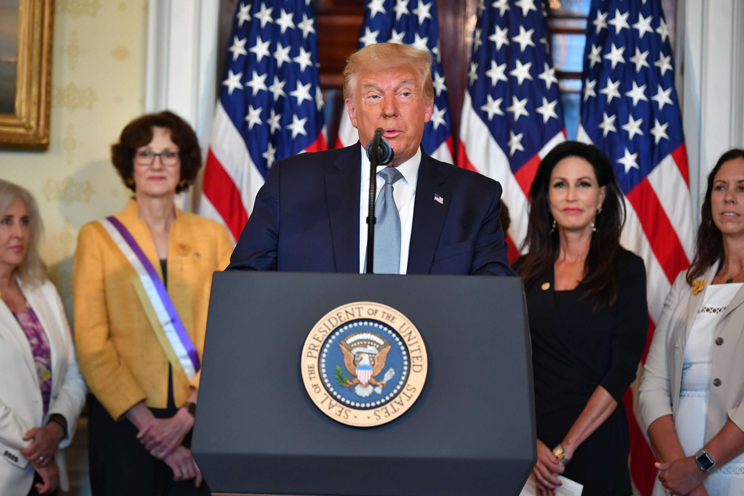 PHOTO: President Donald Trump takes part in the signing of a proclamation on the 100th anniversary of the ratification of the 19th Amendment during an event at the White House, Aug. 18, 2020. 