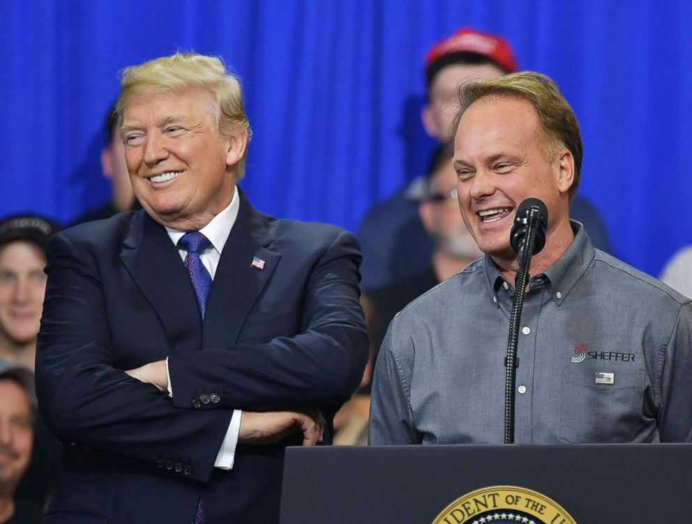 PHOTO: Sheffer Corporation President and CEO Jeff Norris (R) speaks on stage with US President Donald Trump following a tour of the Sheffer Corporation, Blue Ash, Ohio, Feb. 5, 2018. 
