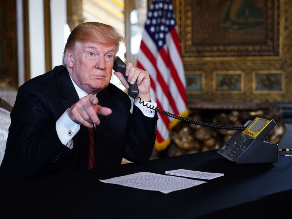 PHOTO: President Donald Trump speaks to members of the military via teleconference from his Mar-a-Lago resort in Palm Beach, Fla., on Thanksgiving Day, Nov. 22, 2018.