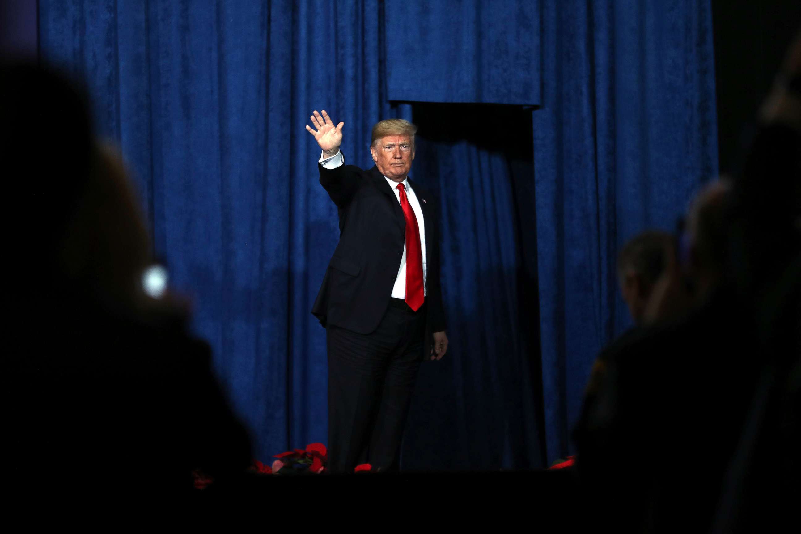 PHOTO: President Donald Trump waves to the crowd after addressing the Project Safe Neighborhoods National Conference In Kansas City, Dec. 7, 2018 in Kansas City, Missouri.