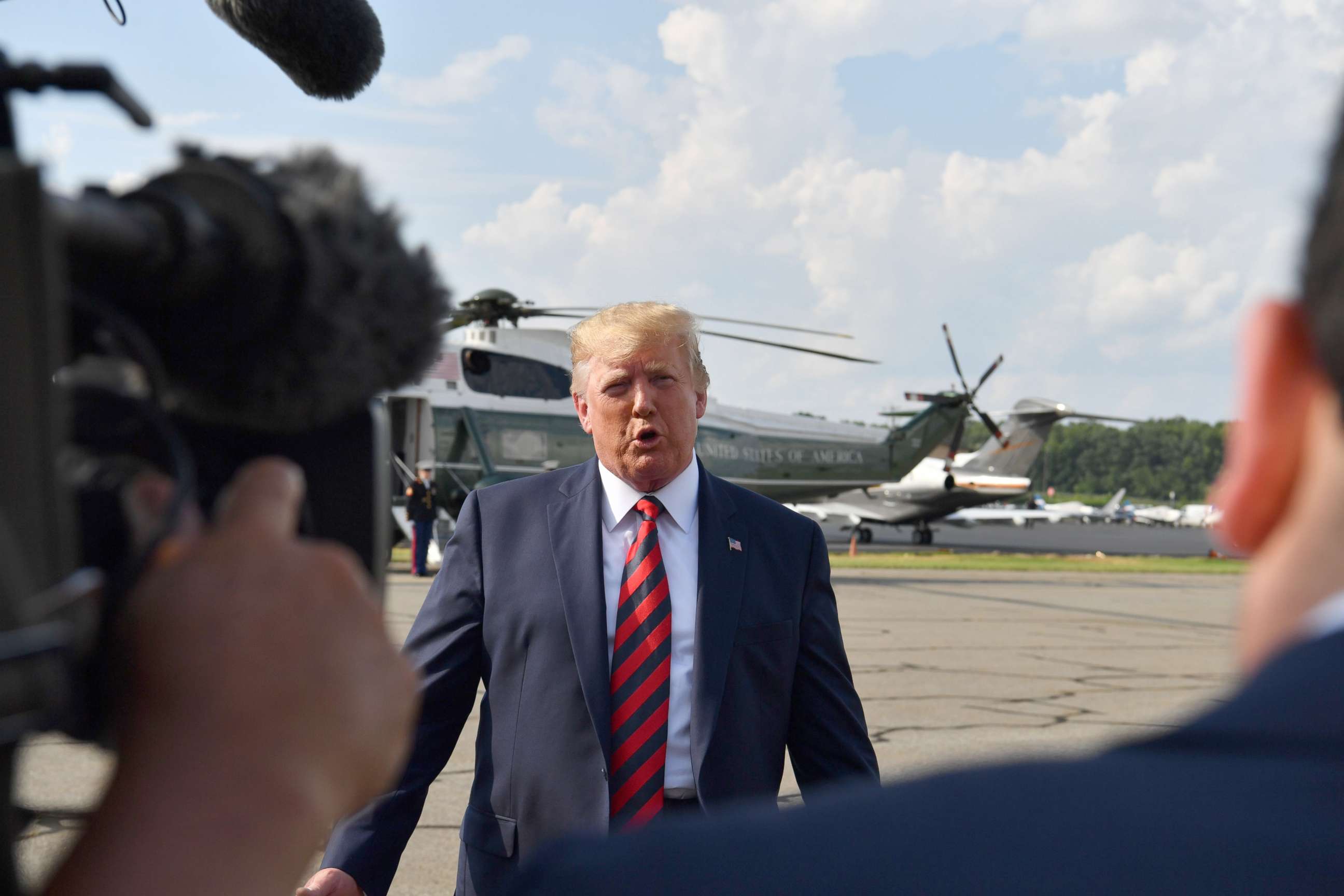PHOTO: President Donald Trump speaks to the press before boarding Air Force One in Morristown, N.J., Aug. 18, 2019.