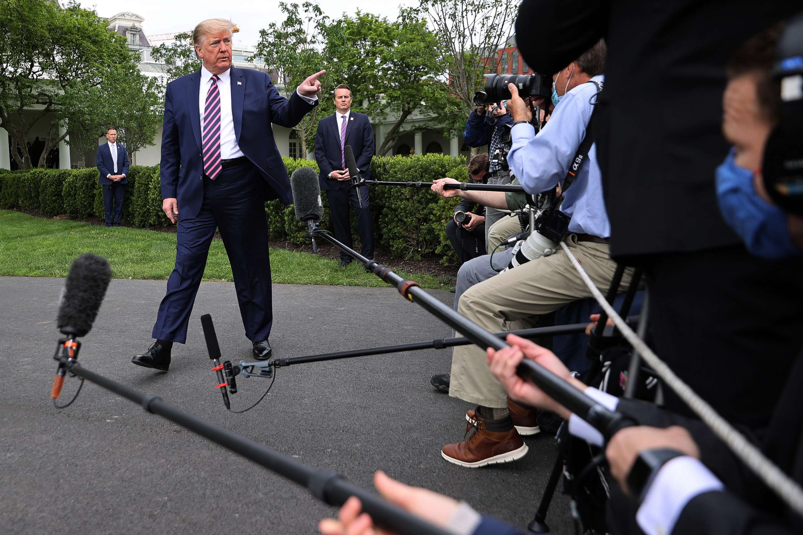 PHOTO: President Donald Trump talks to journalists as he departs the White House, May 5, 2020.