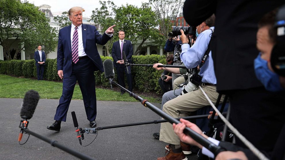 PHOTO: President Donald Trump talks to journalists as he departs the White House, May 5, 2020.