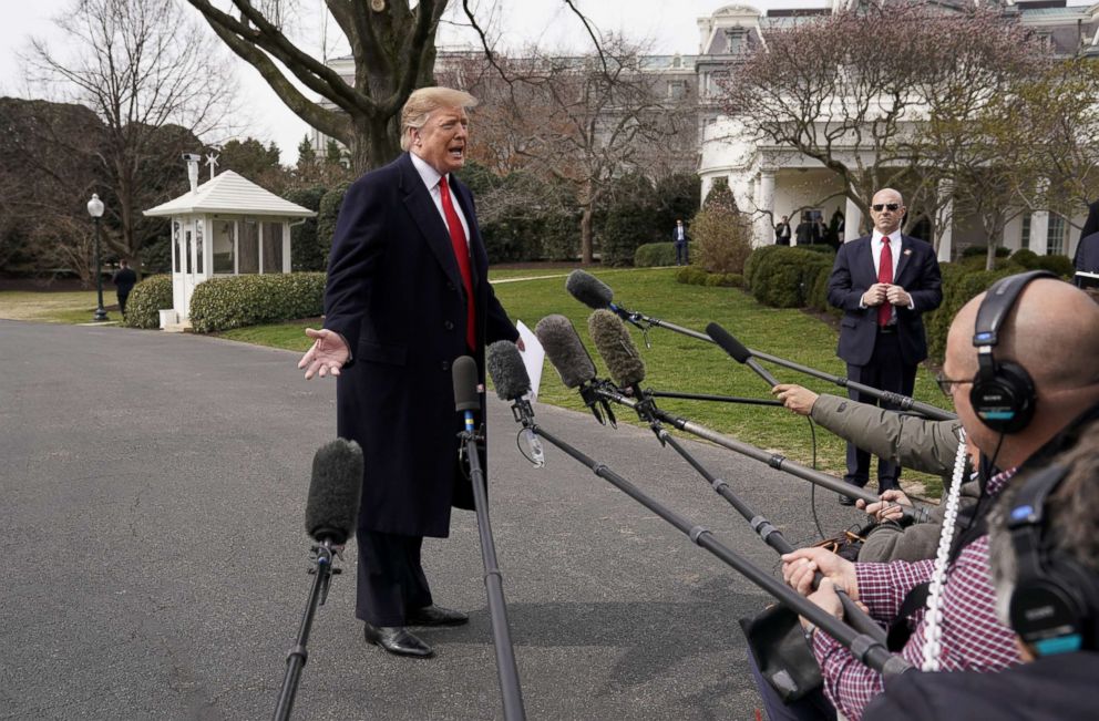 PHOTO: President Donald Trump talks to reporters as he departs on travel to Ohio from the White House, March 20, 2019. 