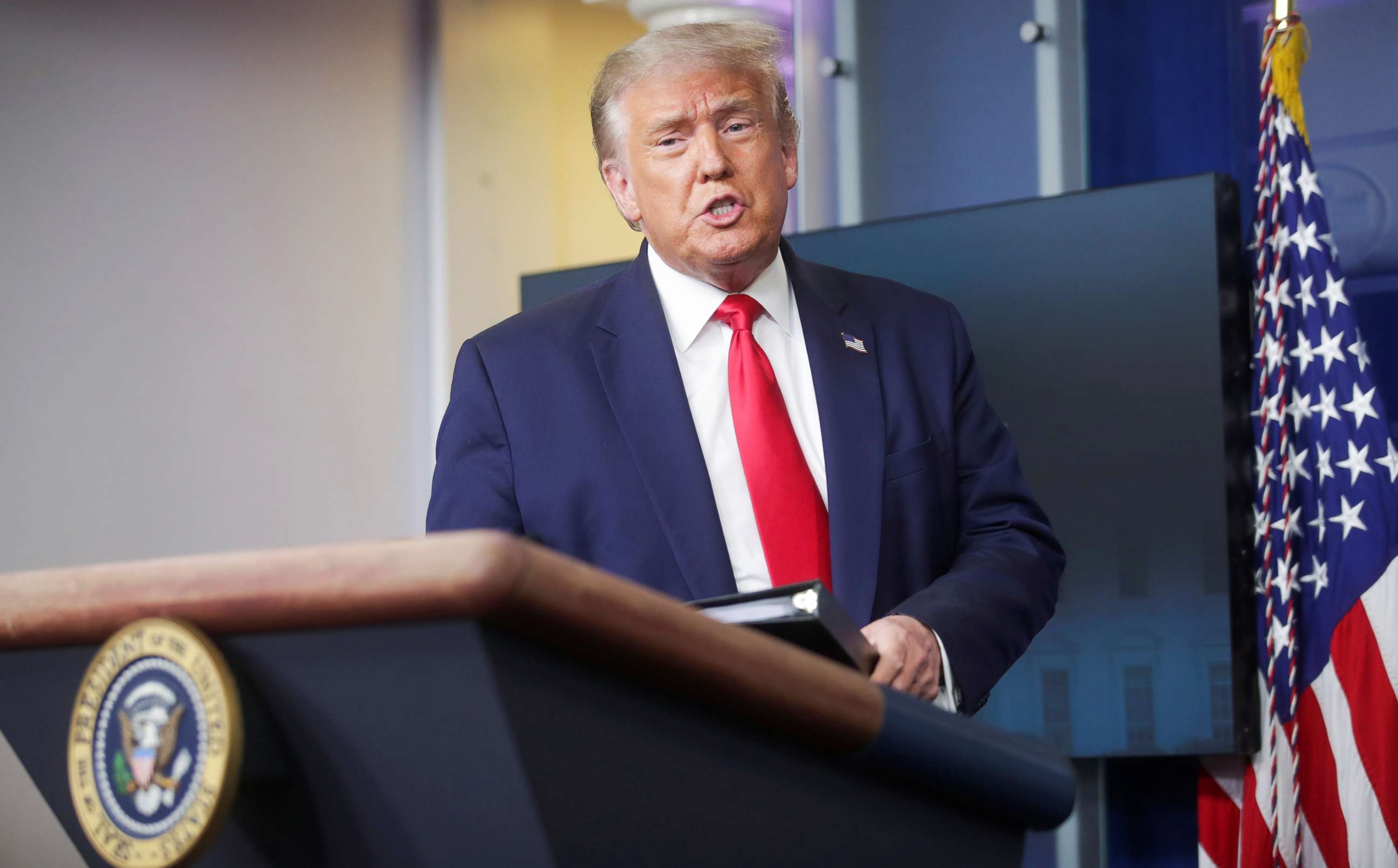 PHOTO: President Donald Trump arrives to hold a coronavirus disease (COVID-19) pandemic briefing in the Brady Press Briefing Room of the White House in Washington, D.C., Aug. 3, 2020. 