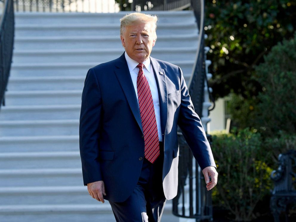 PHOTO:President Donald Trump walks over to talk with reporters on the South Lawn of the White House, Sept. 22, 2019, as he prepares to board Marine One.