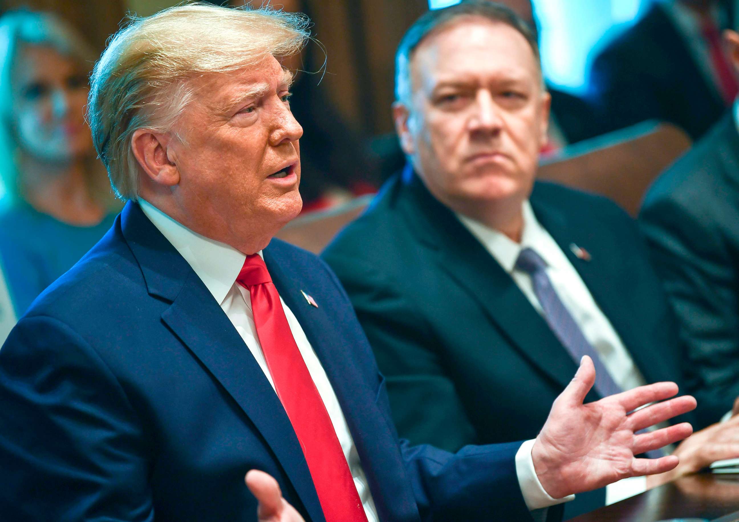 PHOTO: President Donald Trump speaks next to Secretary of State Mike Pompeo during a Cabinet Meeting at the White House, Oct. 21, 2019.
