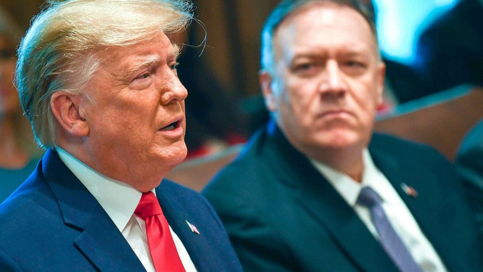 PHOTO: President Donald Trump speaks next to Secretary of State Mike Pompeo during a Cabinet Meeting at the White House, Oct. 21, 2019.