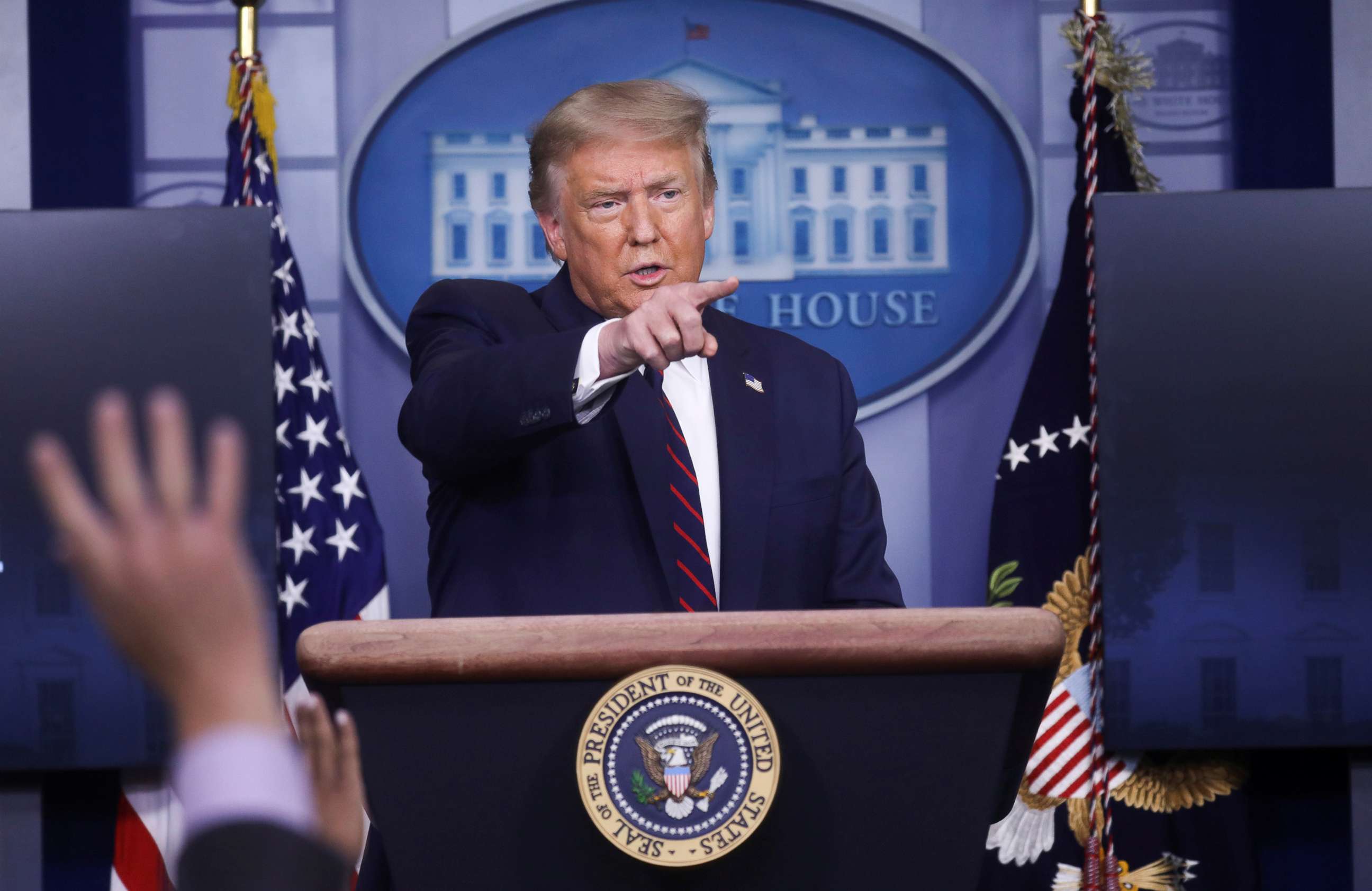 PHOTO: President Donald Trump points to a reporter for a question during a coronavirus disease (COVID-19) response news briefing at the White House, July 21, 2020. 