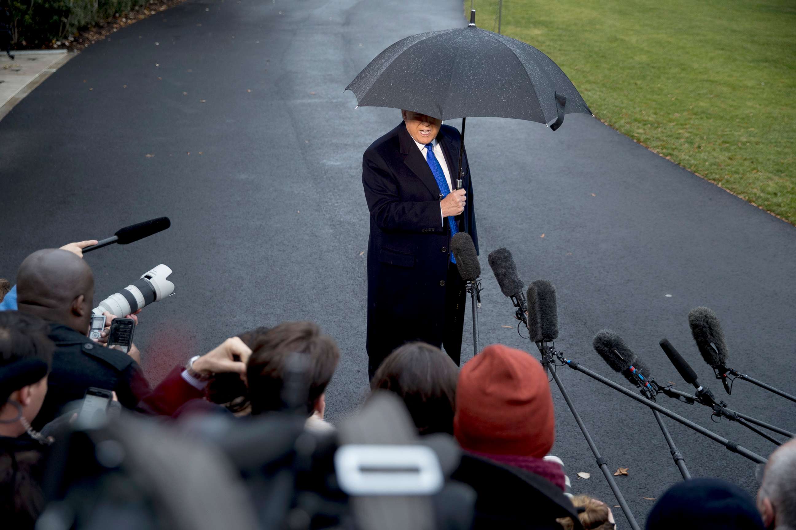 PHOTO: President Donald Trump speaks to members of the media before boarding Marine One on the south Lawn of the White House, Dec. 2, 2019. 