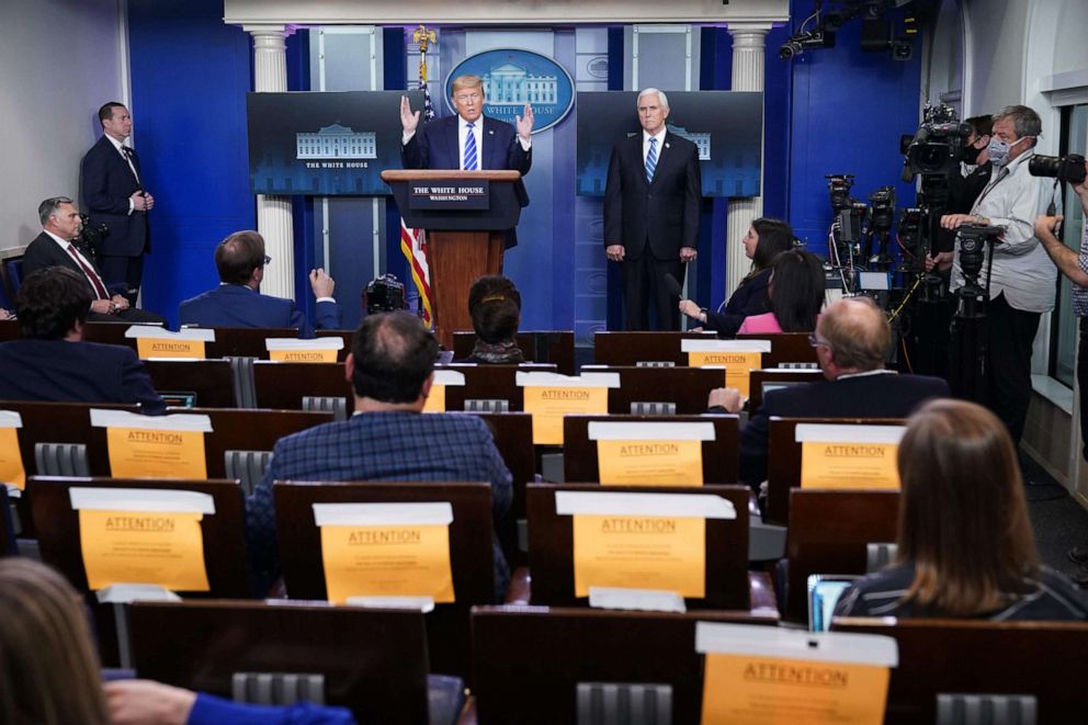 PHOTO: President Donald Trump, flanked by Vice President Mike Pence, speaks during the daily briefing on the novel coronavirus, which causes COVID-19, in the Brady Briefing Room of the White House on April 23, 2020, in Washington.
