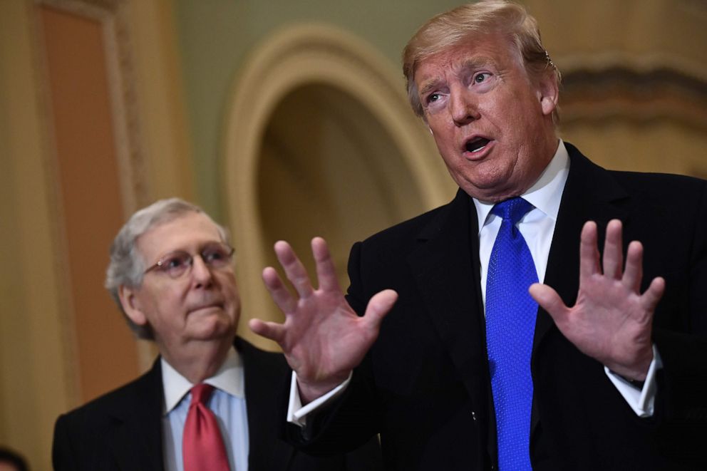 PHOTO: President Donald Trump speaks to the press alongside Senate Majority Leader Mitch McConnell as he arrives on Capitol Hill, March 26, 2019, before joining Senate Republicans for lunch.